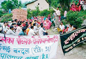 Villagers protest against Om Power Corporation at Palampur on Saturday.