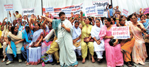 Delhi Pradesh Mahila Congress activists protest against the MCD at Town Hall in the Capital on Monday. Tribune photo