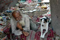 70-year-old Joginder Pal Gullu is forced to spend his days and nights near a garbage dump on the outskirts of Alawalpur township in Jalandhar district.