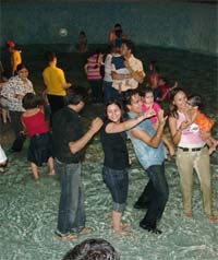 People make merry during a dance party organised by local FM channel.