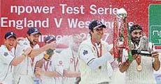 Englands Steven Harmison sprays champagne as Michael Vaughan and Monty Panesar lift the series trophy after they beat the West Indies in the fourth Test in Durham on Tuesday. England won the series 3-0.