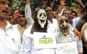 Activists of Indian Justice Party demonstrates against Reliance Fresh Store  in New Delhi on Friday.