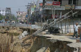 The transformer lying in the trench near Narinder Cinema in Jalandhar on Friday. Photo: S.S. Chopra