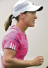 Belgiums Justine Henin celebrates after beating Frances Marion Bartoli in the semifinal of the International Womens Tennis Open in Eastbourne on Friday.