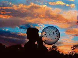 While clouds play hide-and-seek with the sun, a boy enjoys himself with a balloon in Chandigarh on Saturday.