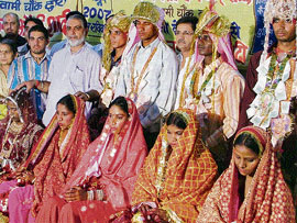 Members of the Ma Bhagwati Club with five couples whose marriages were solemnised by the club in Ludhiana on Sunday.