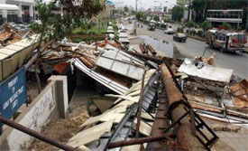 Wreckage of billboards that collapsed due to Saturday rains in Karachi.