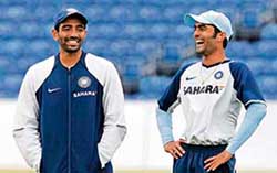 Robin Uthappa (left) and Dinesh Karthik in a jolly mood during a practice session at the Stormont cricket ground in Belfast on Monday. India face South Africa in the first one-dayer on Tuesday. 