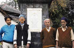 Villagers pose at the war memorial in Jangal.