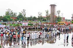 Dera followers holding a protest march against the decision of the Punjab Government to sanction arrest of the dera chief at Sirsa 