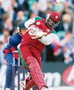 Devon Smith of the West Indies hits a boundary off the bowling of Englands Dimitri Mascarenhas during the Twenty20 match at the Brit Oval