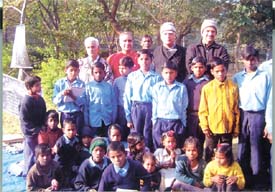 Initiators of Thursday school, Sunil Razdan and Rear Admiral H. C. Malhotra (second and fourth from left in the last row), with schoolchildren at a Noida park
