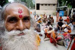 A sadhu rests at the Chandr Bhaga camp in Jammu on Sunday.