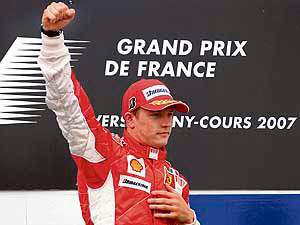 Finnish Ferrari driver Kimi Raikkonen gestures after winning the French Formula One Grand Prix at the Magny-Cours racetrack on Sunday. His Ferrari team-mate Felipe Massa of Brazil finished second, while McLaren-Merc