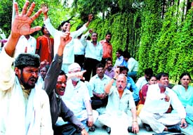 Activists of Bharatiya Jan Sansad sitting on dharna in front of Nirvachan Sadan in the Capital on Monday, demanding `Nagative Voting' in election if all the contesting candidates fail to meet the choice of the electorate. 