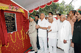 Chief Minister Virbhadra Singh inaugurates the Kisan Bhavan building on the agriculture university campus at Palampur on Monday.