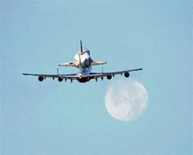 A handout image shows NASAs modified 747 Shuttle Carrier Aircraft with Atlantis on top as it lifts off from Edwards Air Force Base in California to begin its ferry-flight back to the Kennedy Space Center in Florida