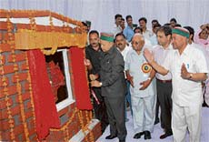 Chief Minister Virbhadra Singh inaugurates a bridge over the Lingti khad on the Manjha-Hangloh road in Palampur subdivision of Kangra district on Tuesday.