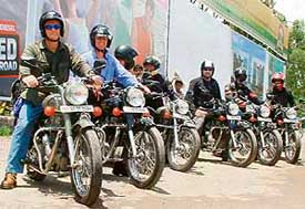 A group of Australians rides through Chandigarh on bikes for a holiday in the hills on Wednesday.