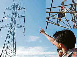 Surinder Singh atop a tower in Banur on Wednesday.
