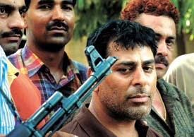 Jagdish Jaggi who has a reward of Rs 25,000 on his head, arrested by Delhi Police in cases of murder and extortion, being presented before the media in the Capital on Thursday.