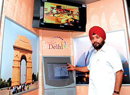 Delhi Tourism Minister Arvinder Singh Lovely launches touch-screen information kiosk for all tourist destinations of Delhi at Delhi Secretariat on Friday.