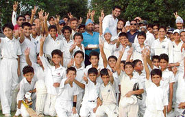 Players celebrate local cricketer Karan Goel’s selection as probable for the Indian team for the Twenty20 Cricket World Cup to be held in September in South Africa.