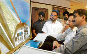 Brig D.C. Katoch (retd) takes a demo of flight simulator at the Sutluj Club, Ludhiana.