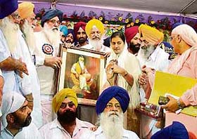 Chief Minister Parkash Singh Badal being presented a portrait of Maharaja Ranjit Singh at a function organised in Ludhiana