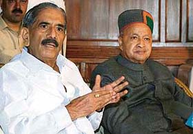 R.K. Dhawan, in charge of party affairs of the Congress in Himachal, and Chief Minister Virbhadra Singh interact with mediapersons in Shimla