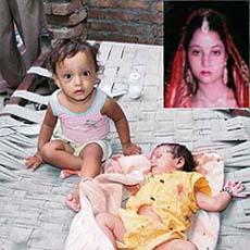 Mona and her younger sister (just 20 days old), who have been virtually orphaned with the murder of their mother, Anuradha (inset) by their father in Ambedkar Nagar in Gyaspura