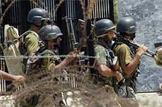 Pakistani soldiers from the Special Services Group return after a strike against radical students at the Red Mosque in Islamabad on Tuesday.
