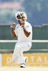Sri Lankas Lasith Malinga celebrates after dismissing Bangladeshs Javed Omer on the first day of the third and final Test at the Asgiriya Stadium in Kandy on Wednesday.