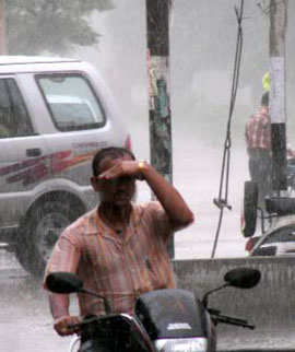A motorist tries to make his way amidst heavy rains that lashed Ambala on Friday