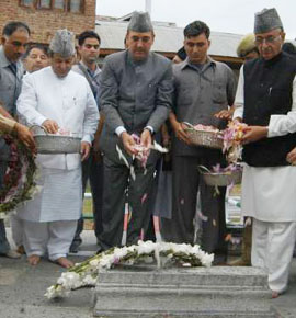 Jammu and Kashmir Chief Minister Ghulam Nabi Azad and senior leaders pay floral tributes at the July 13, 1931,martyrs graveyard in Srinagar on Friday.