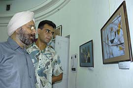 Eye specialist Dr Daljit Singh (left) inaugurated the photo exhibition at Amritsar Art Gallery on Friday.
