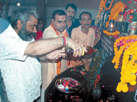 Devotees offer puja to propitiate Saturn at the Sidh Shani Mandir near Alipur in the Capital on Saturday.