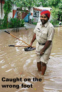 A policeman is all smiles while trying to find his way after heavy rain in Bathinda on Saturday.