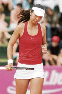 Chinas Tian Tian Sun gestures after beating Belgiums Debbrich Feys during the Fed Cup tennis playoff in Knokke-Heist. Tian won 6-4, 6-2