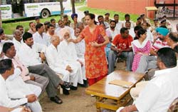 UT SSP Dinesh Bhatt addresses a gathering at the Mani Majra police station during a peace meeting on Sunday afternoon.