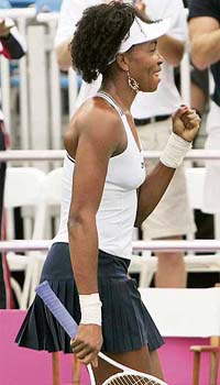 Venus Williams of the USA gestures after beating Russias Nadia Petrova during the Fed Cup tennis semifinal in Stowe, Vermont