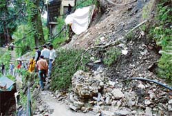A landslide blocks an internal road near the High Court in Shimla on Tuesday, causing a lot of inconvenience to people.