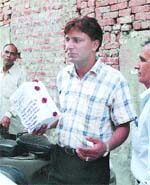 A DRI official shows the contraband recovered in Jalandhar on Tuesday.