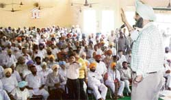 Kila Raipur MLA Jassi Khangura addresses a rally against the alleged excesses and atrocities on Congress workers at Dehlon on Tuesday.
