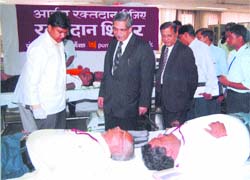 Dr K.C. Chakrabarty, CMD, PNB, interacts with bank employees at a blood donation camp at its corporate office