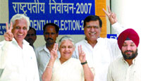 Delhi Chief Minister Sheila Dikshit with Delhi Education Minister Arvinder Singh Lovely, MLA Narender Nath and others show victory signs after voting for the Presidential election at Vidhan Sabha in the Capital on Thursday.