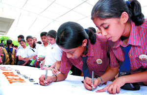 Schoolchildren participate in a signature campaign, urging the government to protect the endangered animals, organised by the World Wildlife Fund (WWF) in the Capital on Thursday.