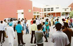 Teaching and non-teaching staff of DAV College, Sector 10 protesting in support of their demands in front of the principal’s office in Chandigarh on Friday.