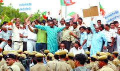 BJP activists protest against the alleged scam in privatisation of the state's power sector in the Capital on Saturday.