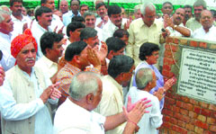 Delhi Mayor Aarti Mehra with the officials of Gopal Gosadan lays the foundation  stone of a pool at Harvali near Babana in the Capital on Saturday.